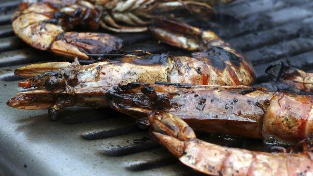 Close up of prawns grilled on BBQ
