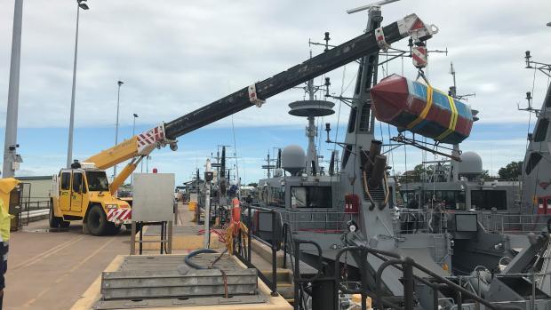 Crane lifting a FAD from HMAS Albany 