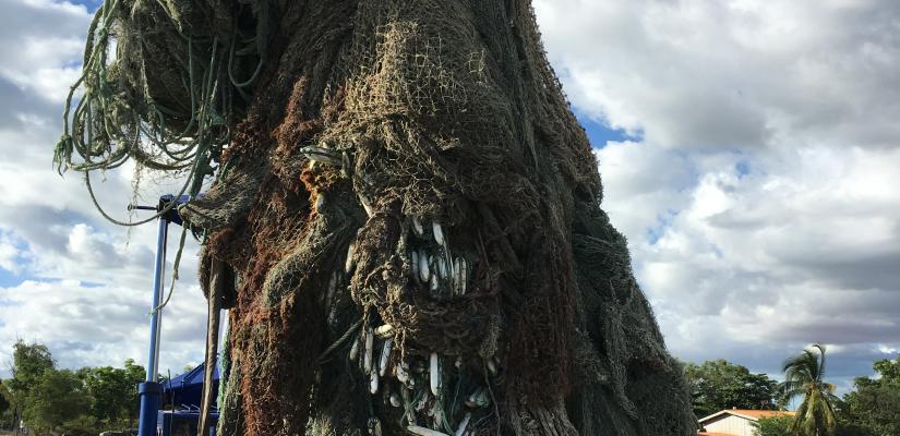 Image of ghost net being lifted onto land