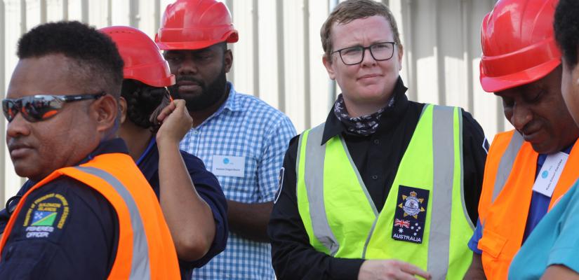 Image of Fisheries Officer Lydia with students in the Pacific.